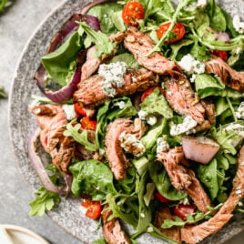 Perfect Grilled Steak Salad with blue cheese on a plate