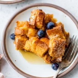 cinnamon baked french toast on a plate with fruit