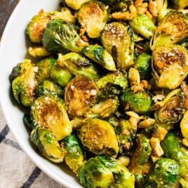 Roasted brussels sprouts with garlic and Parmesan in a white bowl