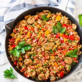 Quick and easy Italian Sausage and Rice Casserole. Cooks in ONE PAN! Smoky chicken sausage, juicy bell peppers, and brown rice in a tomato sauce. One of our favorite healthy weeknight dinners! Recipe at wellplated.com | @wellplated {gluten free}