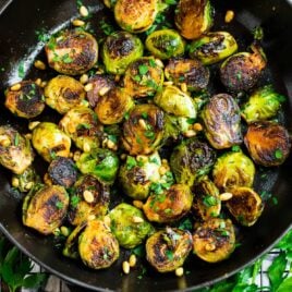A pan of sautéed brussels sprouts with balsamic