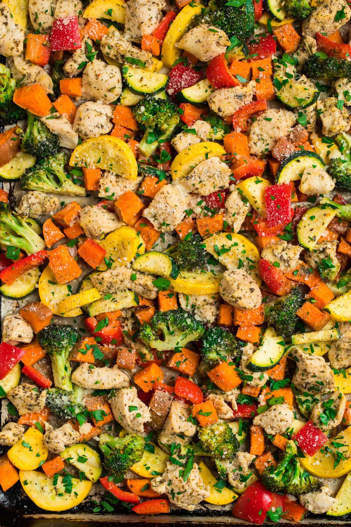 Chicken and vegetables on a baking sheet