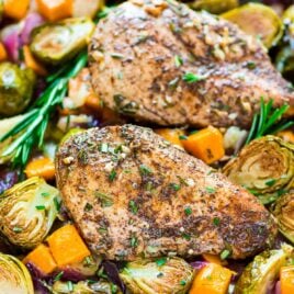 ONE PAN Paleo Harvest Chicken Dinner with Apples, Sweet Potatoes, and Brussels Sprouts. Easy and healthy sheet pan recipe that’s perfect for busy weeknights. {Paleo, Gluten Free, and Dairy Free!} @wellplated
