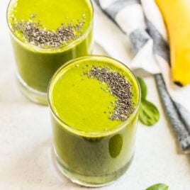 Two glasses of green smoothie with chia seeds