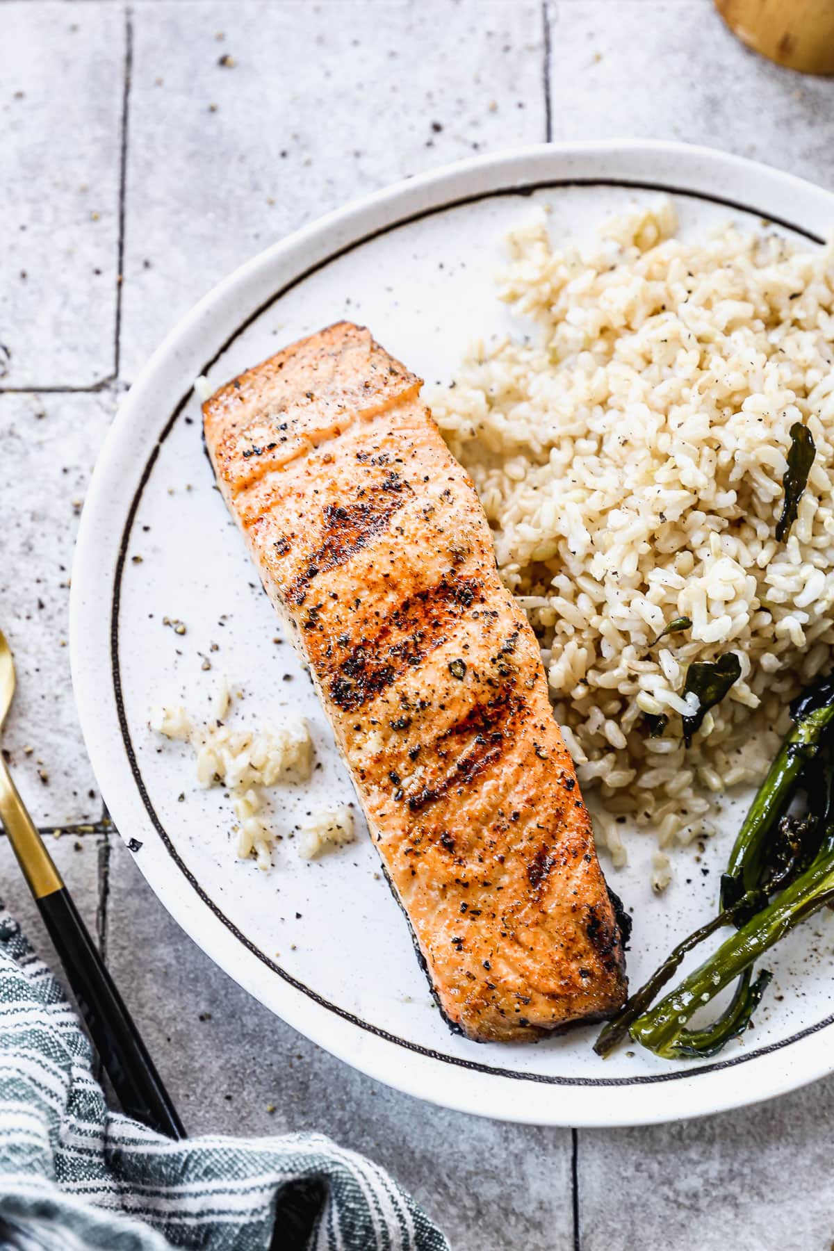 grilled salmon recipe on a plate with rice