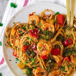 Spicy Shrimp Pasta. A fast, flavorful, healthy shrimp recipe! With garlic, lots of veggies, whole wheat spaghetti, and an easy tomato sauce, this is one of our go-to weeknight main dishes.