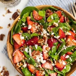 The best ever Spinach Strawberry Salad with Balsamic Poppyseed Dressing, pecans, and feta or goat cheese.