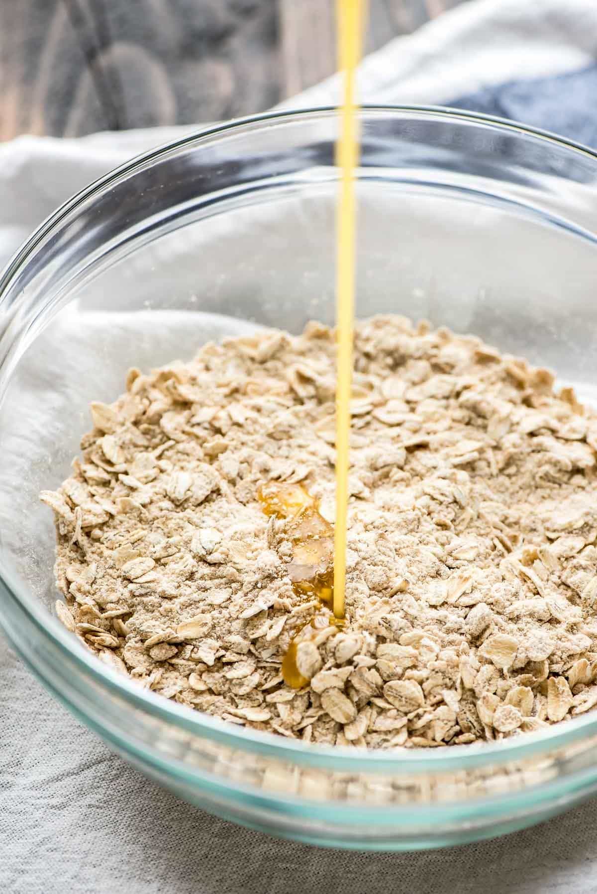 bowl of rolled oats drizzled with honey