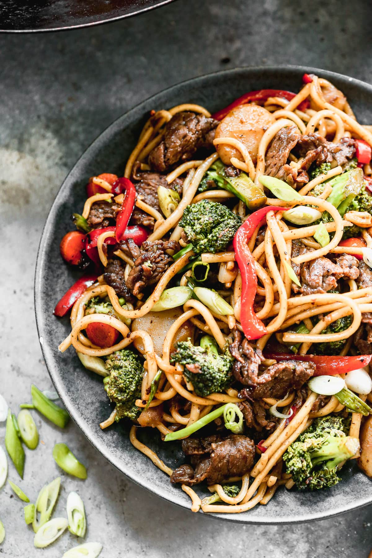 beef lo mein recipe with vegetables on a plate