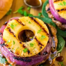 Hawaiian Teriyaki Burgers with Grilled Pineapple and Onion. Juicy teriyaki burger patties made with ground chicken or turkey, glazed with an easy homemade teriyaki burger sauce. Simple, healthy, and delicious! Recipe at wellplated.com | @wellplated