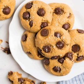 A white plate with chocolate chip almond flour cookies