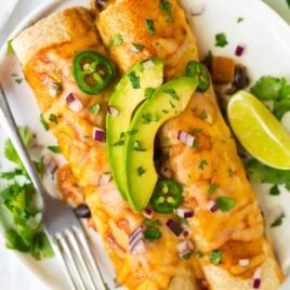 Easy, filling, and delicious Vegetarian Enchiladas with Butternut Squash, Black Beans, and Cheese. A healthy, flavorful casserole recipe that’s freezer friendly and perfect a for meatless Monday.