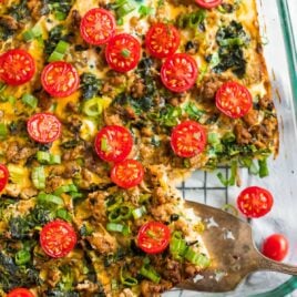 Easy Homemade Whole30 Breakfast Casserole with sausage, spinach, eggs, and tomatoes in a serving dish